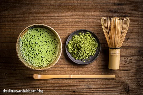 Matcha bowl with whisk and powder seen from above